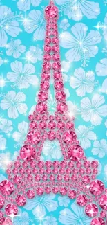 Eiffel Tower glittering in pink crystals on a blue floral background.