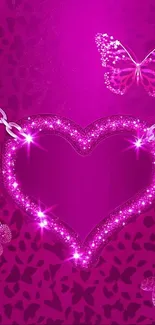 Sparkling pink heart pendant with butterflies on a vibrant background.