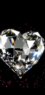 Heart-shaped diamond on black background with sparkling effect.