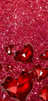 Red gemstone hearts over glittery background, vibrant and romantic.