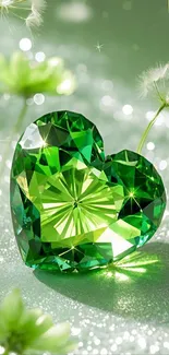 Heart-shaped green gem with sparkles.