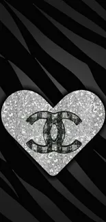 Glittering heart logo on black background wallpaper.