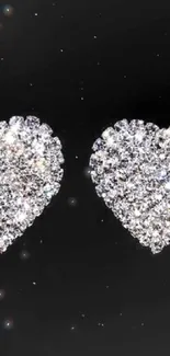 Sparkling heart wallpaper with glitter on a black background.