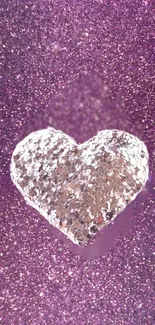 Pink glitter wallpaper with sparkling heart design.