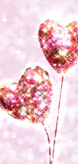 Two sparkling glitter heart shapes on a pink background.