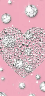 Sparkling diamond heart on soft pink background with glittery accents.