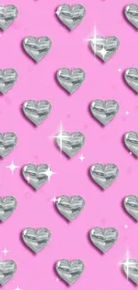 Shiny crystal heart pattern on a pink background wallpaper.