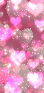 Glittery pink background with sparkling heart shapes on phone wallpaper.