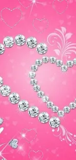 Diamond heart design on pink background wallpaper with sparkling effect.