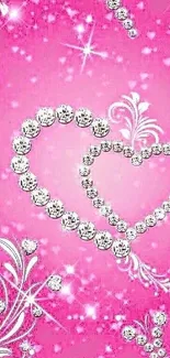 Sparkling heart design on pink background with diamond accents.