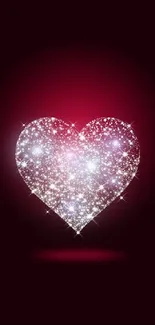 Sparkling heart design on dark red background wallpaper.