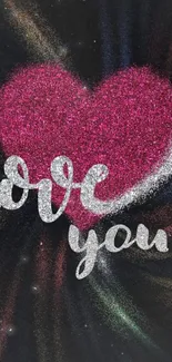 Pink glittery heart with 'love you' text on black background.