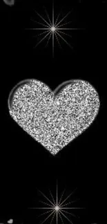 Sparkling heart on a black background wallpaper.