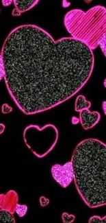 Sparkling black hearts wallpaper with pink trim.