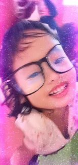 Smiling girl with glasses and pink sparkles background.