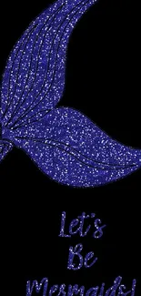 Dark blue mermaid tail with glitter on black background.