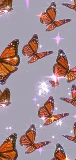 Grey background with sparkling monarch butterflies.