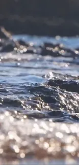 Close-up of ocean waves reflecting sunlight.