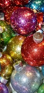 Vibrant and glittery holiday ornaments wallpaper.