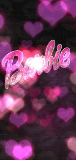 Barbie logo in pink glitter on black background.