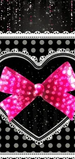 Sparkling pink bow on heart with polka dots.