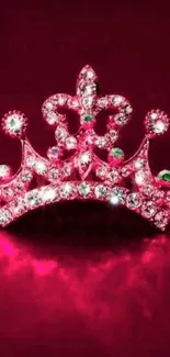 Sparkling pink crown on a deep pink velvet background.