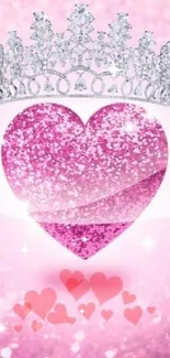 Pink heart with silver crown, glittery background.