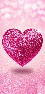 Sparkling pink heart on glittery background wallpaper.