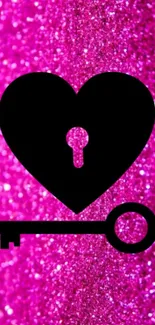 Pink glitter background with black heart and key design.