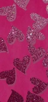 Pink glitter heart wallpaper with sparkles.