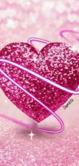 Sparkling pink heart with shimmering accents on a glittery background.