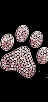 Sparkling pink jeweled paw on black background.