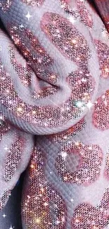 Glittering pink snake with sparkling scales on phone wallpaper.