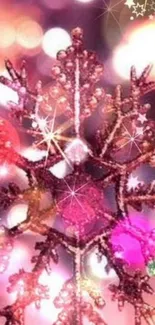 Sparkling pink snowflake with bokeh lights background.