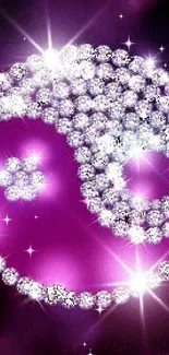 Sparkling purple yin yang design with crystals and deep purple background.