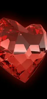 Red heart-shaped gemstone on black background mobile wallpaper.