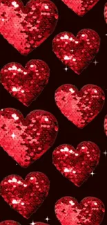 Sparkling red hearts pattern on dark background.