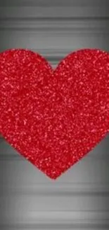 Glittering red heart on a sleek black gradient background.