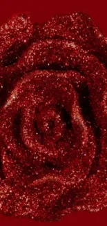 Sparkling red rose with glitter details on a deep red background.