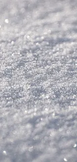 Close-up of sparkling snow texture creating a calming, wintry mobile wallpaper.