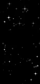 Starry night wallpaper with shimmering white stars on a black background.