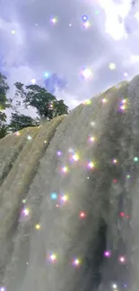 Waterfall with sparkling lights under a blue sky.