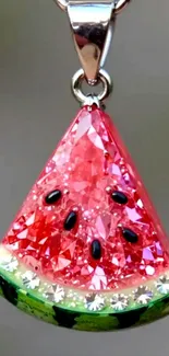 Sparkling watermelon-shaped pendant with crystal design.