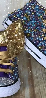 Dazzling sneakers with beads and gold sequin bows on a wooden floor.