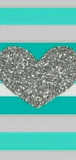 Glitter heart on turquoise striped wallpaper.