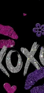 Glittery XOXO and lips on black wallpaper.