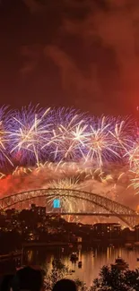 Vibrant fireworks light up Sydney Harbour Bridge at night.