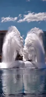Majestic urban fountain with city skyline backdrop.