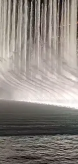 Elegant nighttime fountain display with illuminated water streams.