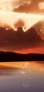 Breathtaking sunset with vibrant clouds reflecting on a serene lake.